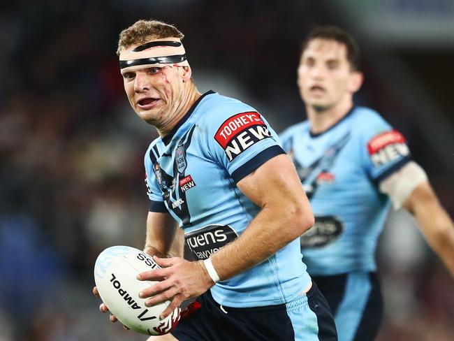 GOLD COAST, AUSTRALIA - JULY 14: Tom Trbojevic of the Blues makes a break during game three of the 2021 State of Origin Series between the New South Wales Blues and the Queensland Maroons at Cbus Super Stadium on July 14, 2021 in Gold Coast, Australia. (Photo by Chris Hyde/Getty Images)