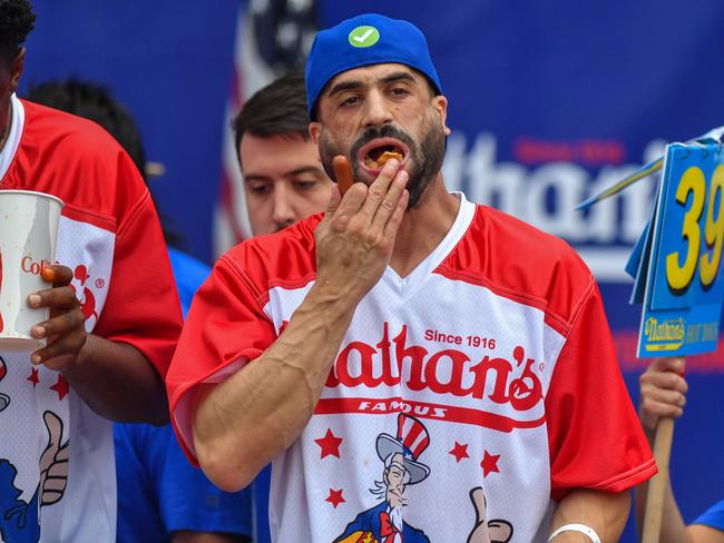 James Webb competes in the 2023 Nathan's Famous International Hot Dog Eating Contest at Coney Island on July 4, 2023 in New York City.