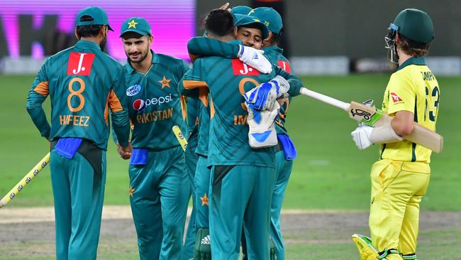 Pakistan's cricketers celebrate at the end of the third T20 game, in Dubai. Picture: AFP