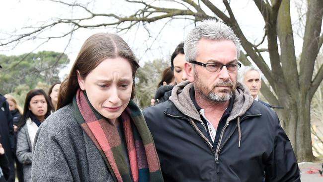 Borce Ristevski (centre right) the husband of missing Melbourne woman Karen Ristevski and their daughter leave a press conference after pleading for information as police search the Maribrynong River for her belongings in Melbourne, Thursday, July, 14, 2016. (AAP Image/Tracey Nearmy) NO ARCHIVING