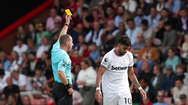 Referee Peter Bankes shows a yellow card to Lucas Paqueta of West Ham United during the Premier League match against Bournemouth on August 12, 2023. (Photo by Henry Browne/Getty Images)