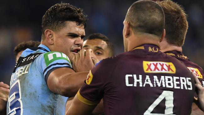 Latrell Mitchell of the Blues (left) and Will Chambers of the Maroons wrestle during Game 1 of the 2018 State of Origin series at the MCG in Melbourne, Wednesday, June 6, 2018. (AAP Image/Julian Smith) NO ARCHIVING, EDITORIAL USE ONLY