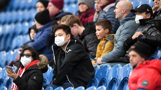 Fans wear disposable face masks at the Premier League match between Burnley FC and Tottenham Hotspur at Turf Moor. Picture: Getty Images