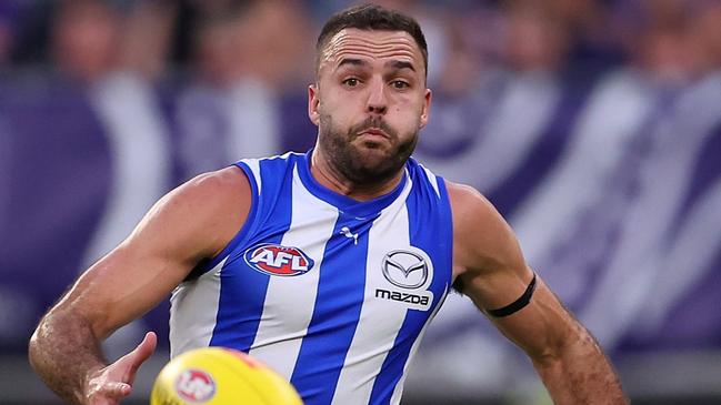 North Melbourne key defender Griffin Logue is challenging a week on the sidelines at Tuesday night’s AFL tribunal following a high bump on Hawk Will Day. Picture: Paul Kane / Getty Images