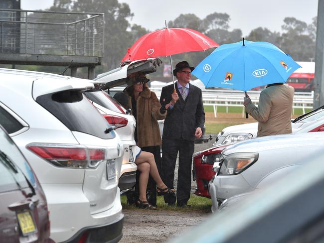 Punters brave the wet weather for an early start. Picture: Jay Town