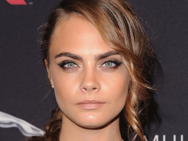 British model Cara Delevingne has brought back lush eyebrows. But that won’t fly with some sorority girls. Photo: Jon Kopaloff/FilmMagic.