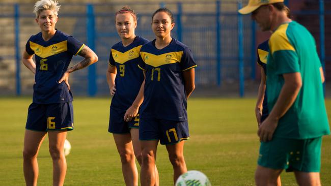 The Matildas get to work on the training pitch in Brazil.