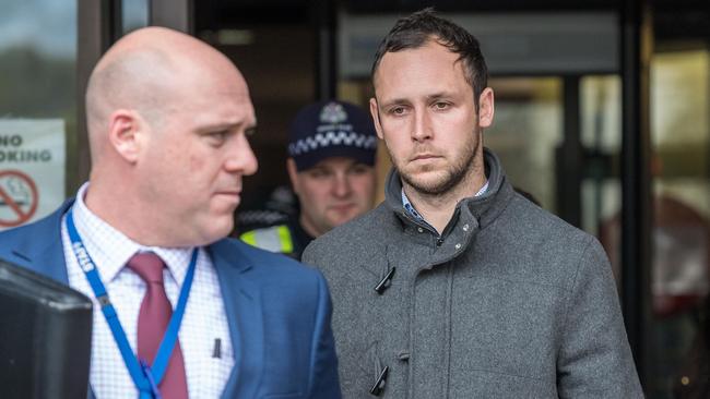 Ryan Wells is escorted by police from the Frankston court after an earlier hearing. Picture: Jake Nowakowski