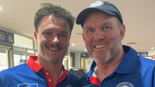 Parker and Jason Heatley celebrate a North Heidelberg win.