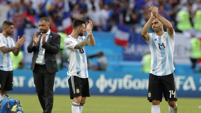 Argentina's Lionel Messi, centre, and Argentina's Javier Mascherano, right. (AP Photo/Ricardo Mazalan)