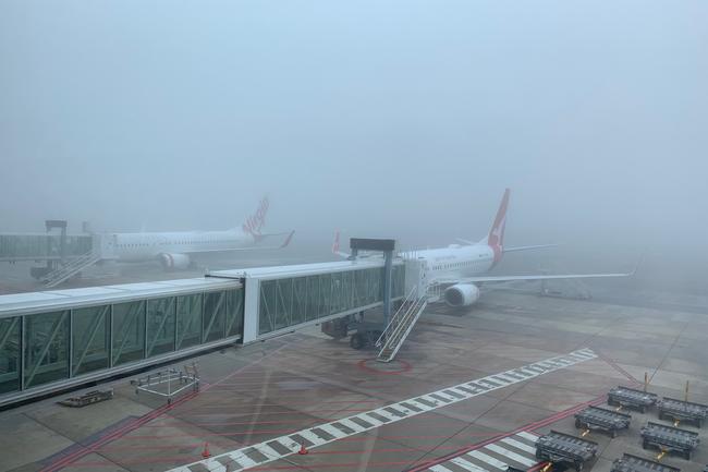 Adelaide Airport shrouded in fog on July 14. Picture: Tait Schmaal