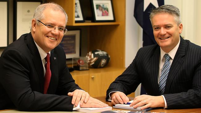 Treasurer Scott Morrison and Minister for Finance Mathias Cormann with the Budget. Picture Kym Smith