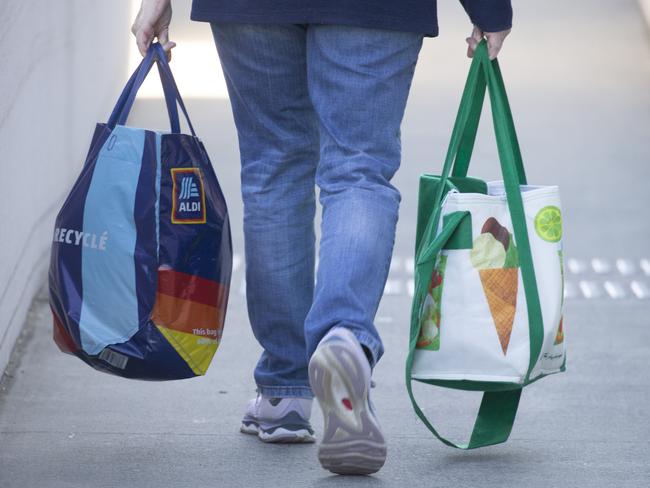 BRISBANE, AUSTRALIA - NewsWire Photos - JUNE 19, 2024: Generic photo of Australian shopping centre ALDI and Woolworths bags.Picture: NewsWire / Glenn Campbell