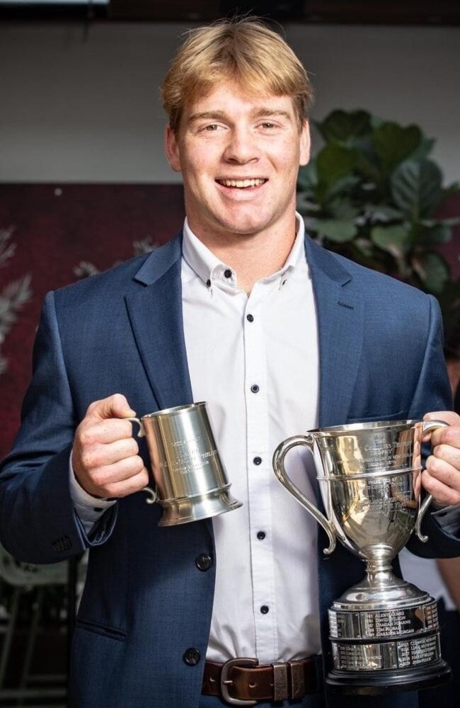 Harry McLaughlin-Phillips posing with his Under 20s Player of the Year silverware. Pic: Brendan Hertel/QRU.