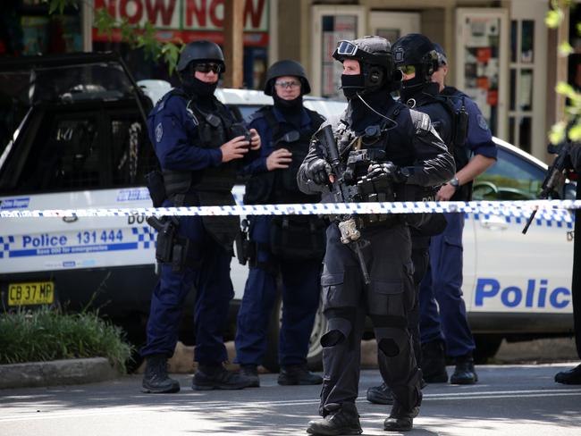 Heavily armed police patrol Argyle Street in Picton. Picture: Jonathan Ng