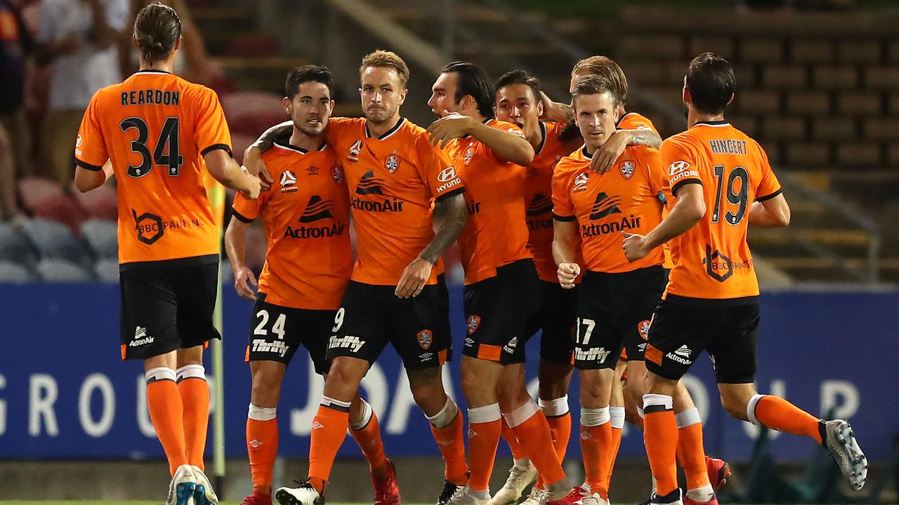 Brisbane Roar players celebrate a goal. (Photo by Tony Feder/Getty Images)