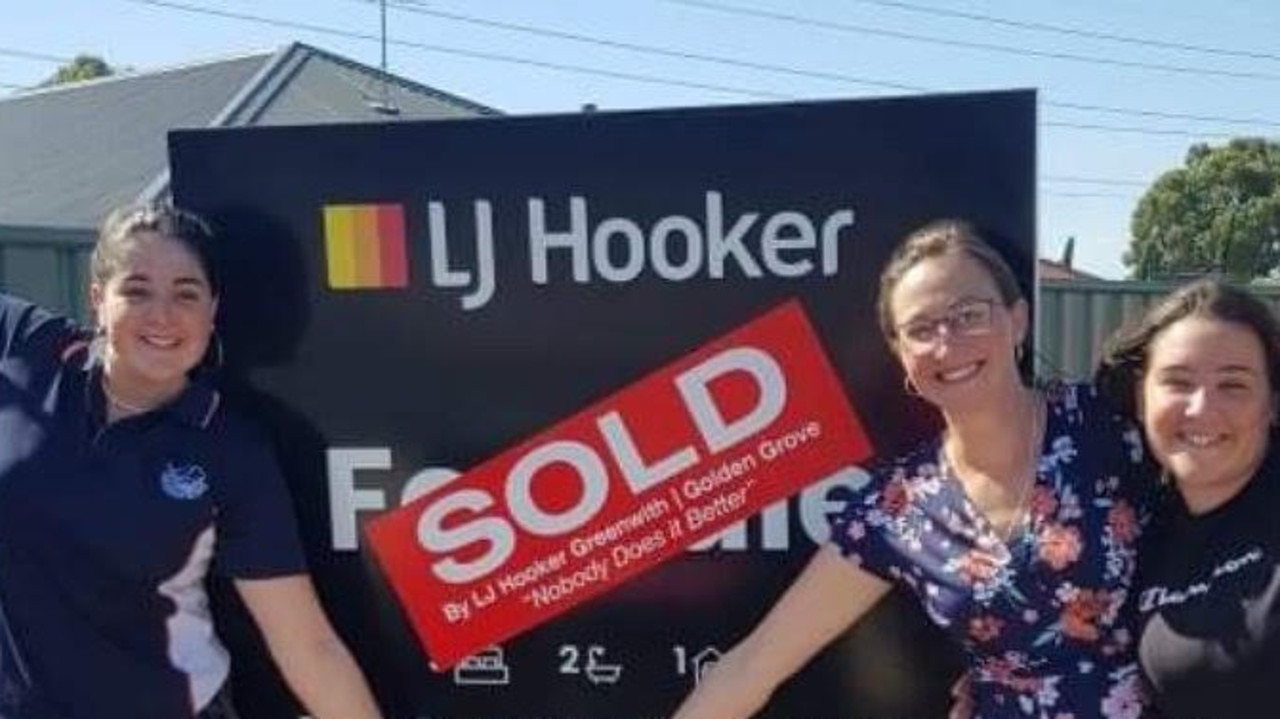 Leila Cienciala and her two daughters celebrate their new home. Picture: Supplied