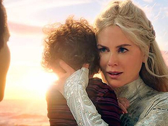 Nicole Kidman as Queen Atlanna protecting a young Arthur Curry in Aquaman.