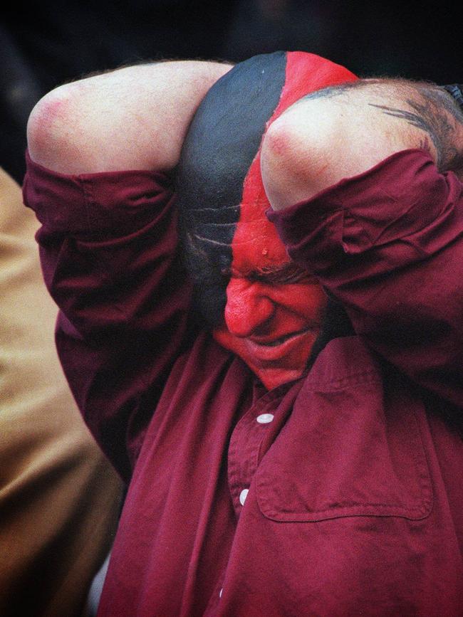 An Essendon fan can’t believe the result.