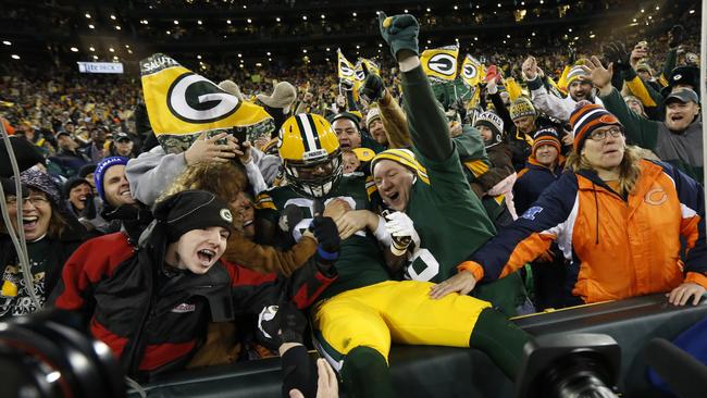 Green Bay Packers tight end Brandon Bostick (86) celebrates a touchdown with fans.