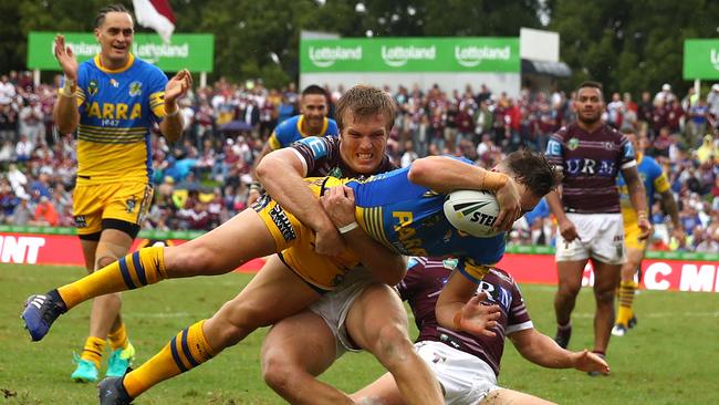 Clint Gutherson of the Eels scores a try on Sunday at Lottoland.