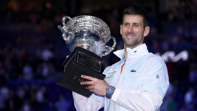 MELBOURNE, AUSTRALIA - JANUARY 29:  Novak Djokovic of Serbia poses for photographs with the Norman Brookes Challenge Cup after winning the Men's Singles Final match against Stefanos Tsitsipas of Greece during day 14 of the 2023 Australian Open at Melbourne Park on January 29, 2023 in Melbourne, Australia. (Photo by Clive Brunskill/Getty Images)