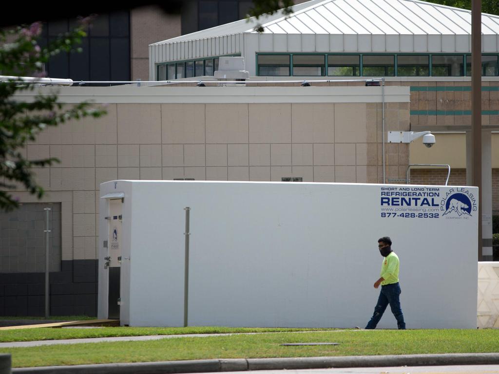 A refrigerated trailer sits outside of HCA Houston Healthcare Northwest in July, where it will be used as a temporary morgue. Picture: Mark Felix/AFP.