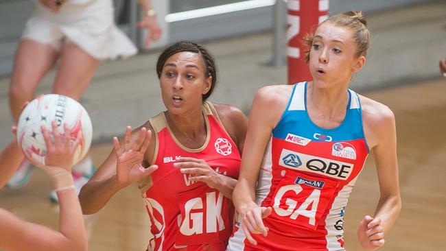 Swifts English star Helen Housby, left, under pressure from England defender Geva Mentor who plays for Lightning.