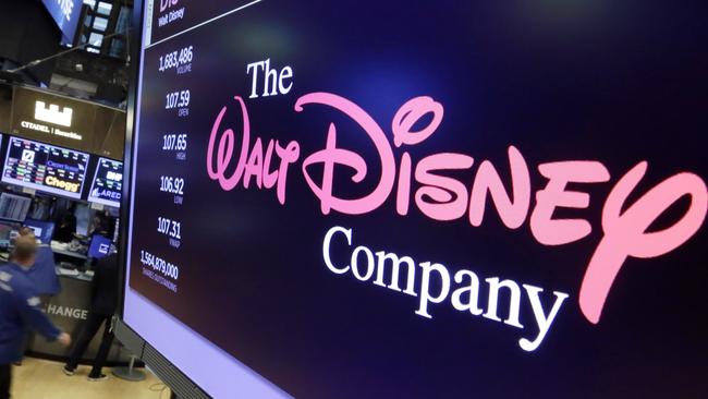 FILE - In this Aug. 8, 2017, file photo, The Walt Disney Co. logo appears on a screen above the floor of the New York Stock Exchange. Disney closed its $71 billion acquisition of Foxâ€™s entertainment assets on Wednesday, March 20, 2019, more than a year after the mega merger was proposed. Disney gets far ranging properties ranging from Foxâ€™s film studios, including â€œAvatarâ€ and X-Men, to its TV productions such as â€œThe Simpsonsâ€ and networks including National Geographic. (AP Photo/Richard Drew, File)