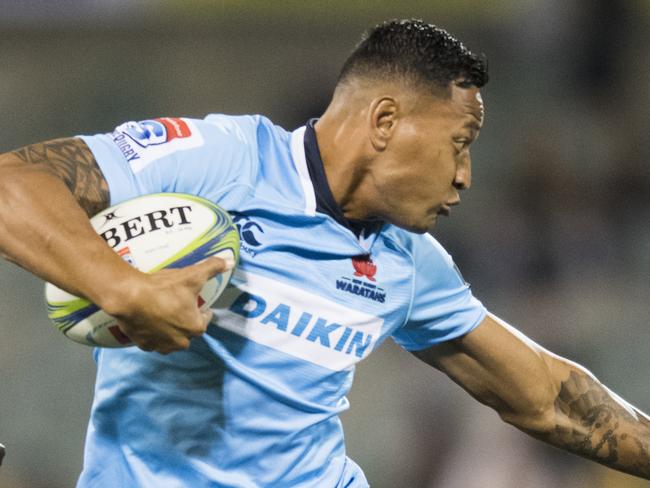 Israel Folau of the Warathas fends off a tackle during the Round 7 Super Rugby match between the Brumbies and the NSW Waratahs at GIO Stadium in Canberra, Saturday, March 31, 2018. (AAP Image/Rohan Thomson) NO ARCHIVING, EDITORIAL USE ONLY