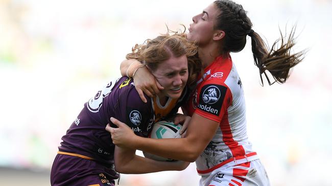 Tamika Upton of the Broncos is tackled by Jessica Sergis of the Dragons during the 2019 NRLW Grand Final between the Brisbane Broncos and the St George Illawarra Dragons at ANZ Stadium in Sydney, Sunday, October 6, 2019. (AAP Image/Dan Himbrechts) NO ARCHIVING, EDITORIAL USE ONLY