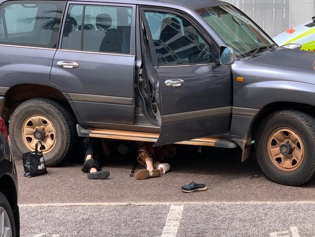 The two women pinned underneath the LandCruiser, in the aftermath of the incident in the Darwin CBD yesterday afternoon.