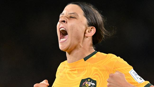 FILES-- This file photo taken on August 16, 2023 shows Australia's forward Sam Kerr celebrating scoring her team's first goal during the Australia and New Zealand 2023 Women's World Cup semi-final football match between Australia and England at Stadium Australia in Sydney. Chelsea and Australian women's football star Sam Kerr has been charged with a "racially aggravated offence" in Britain following a dispute involving a police officer, London's Metropolitan Police said March 4. The 30-year-old striker, one of the highest profile and best-paid players in the women's game, was charged following an incident in London in January 2023, a police statement read. (Photo by IZHAR KHAN / AFP)