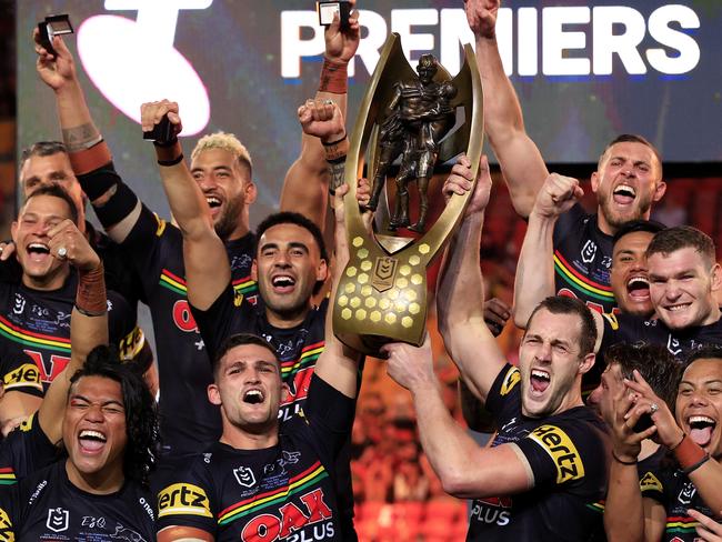 Nathan Cleary, Isaah Yeo and the Panthers celebrate winning the 2021 NRL Grand Final between the Penrith Panthers and Souths Sydney Rabbitohs at Suncorp Stadium in Brisbane. Pics Adam Head