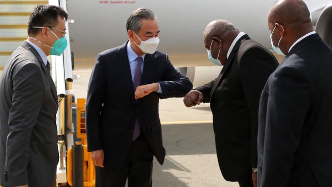 Papua New Guinea officials receive Chinese Foreign Minister Wang Yi as he arrived at Port Moresby for a two-day official visit. Picture: Andrew Kutan/AFP