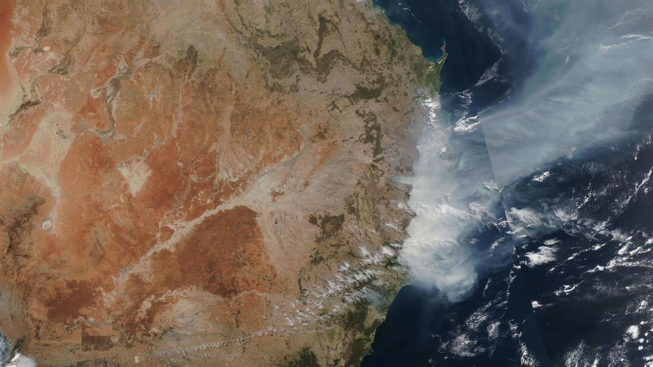 A satellite image from NASA shows bushfire smoke spreading across NSW and into the Tasman Sea. Picture: NASA