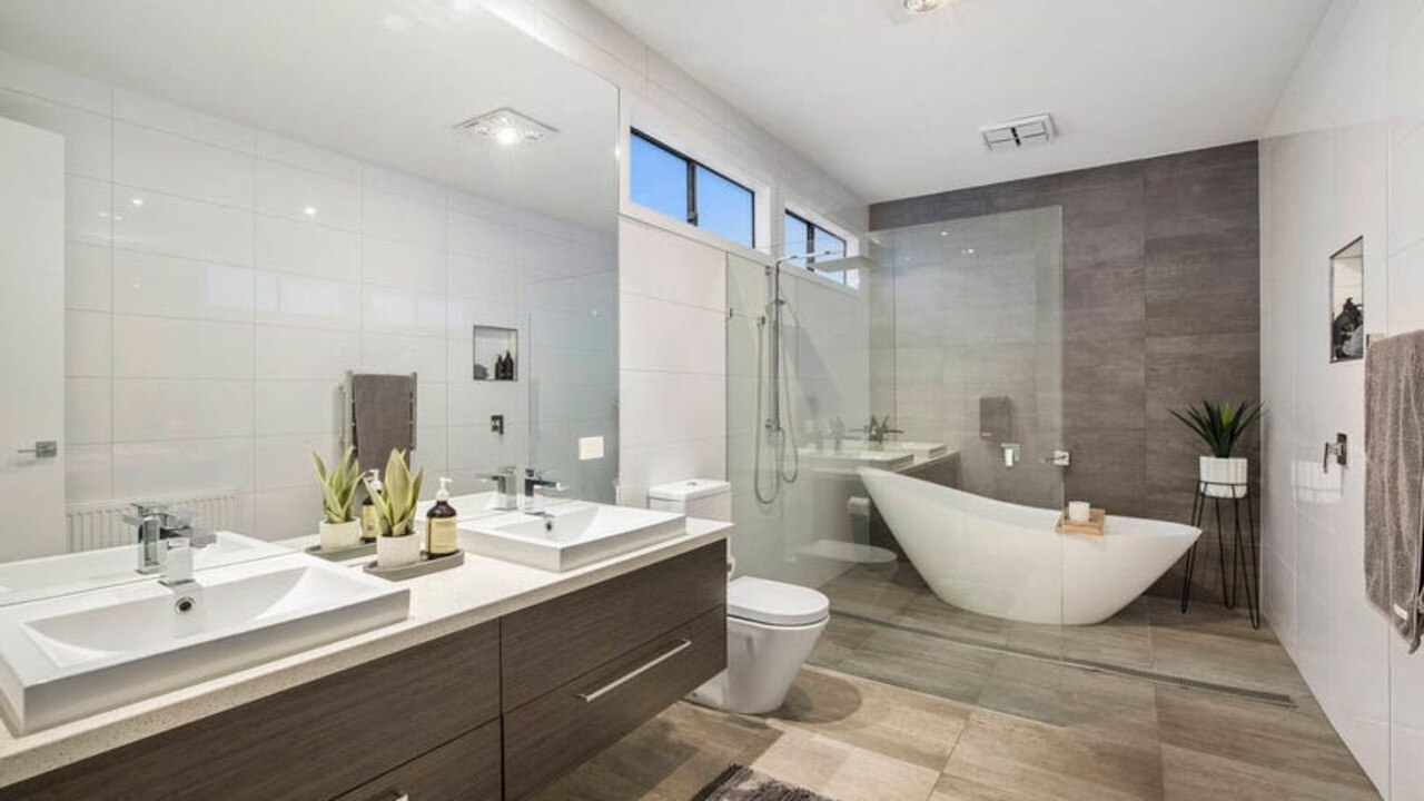 His and her sinks and a modern freestanding bath are eye-catching additions in the main bathroom.