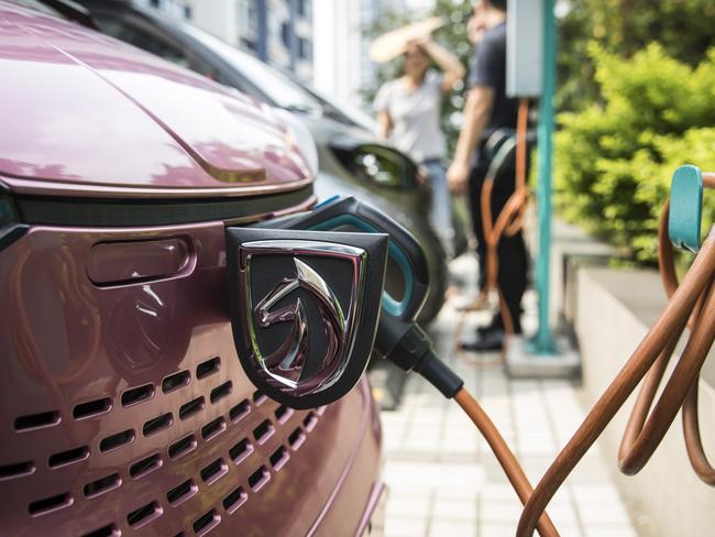 A Baojun E100 electric vehicle stands plugged in to a charging station outside a SAIC-GM-Wuling Automobile Co. Baojun E100 Customer Experience Center, a joint venture between SAIC Motor Corp., General Motors Co. and Liuzhou Wuling Automobile Industry Co., in Liuzhou, Guangxi province, China, on Wednesday, May 23, 2018. GM and its partners sold 4 million vehicles in China in 2017, about 1 million more than the automaker sold in the U.S. Photographer: Qilai Shen/Bloomberg