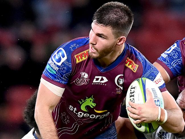 BRISBANE, AUSTRALIA - JUNE 04: Liam Wright of the Reds takes on the defence during the round four Super Rugby Trans-Tasman match between the Queensland Reds and the Blues at Suncorp Stadium on June 04, 2021 in Brisbane, Australia. (Photo by Bradley Kanaris/Getty Images)