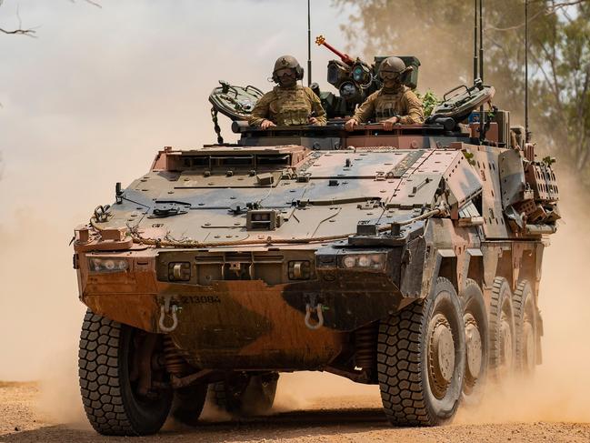 Soldiers from the 2nd/14th Light Horse Regiment (Queensland Mounted Infantry) in an Australian Army Boxer Combat Reconnaissance Vehicle conduct a battle run at Townsville Field Training Area, Queensland. *** Local Caption *** The 2nd/14th Light Horse Regiment (Queensland Mounted Infantry) conducted live fire training serials in the Townsville Field Training Area with the new Boxer Combat Reconnaissance Vehicles as they were introduced into service within the Australian Army. Soldiers conducting the training practiced firing smoke canisters from the platform’s Grenade Launching System to create obscuration, engaging targets with the MAG-58 Machine Gun, and honed their skills on the digitised 30mm Main Turret.