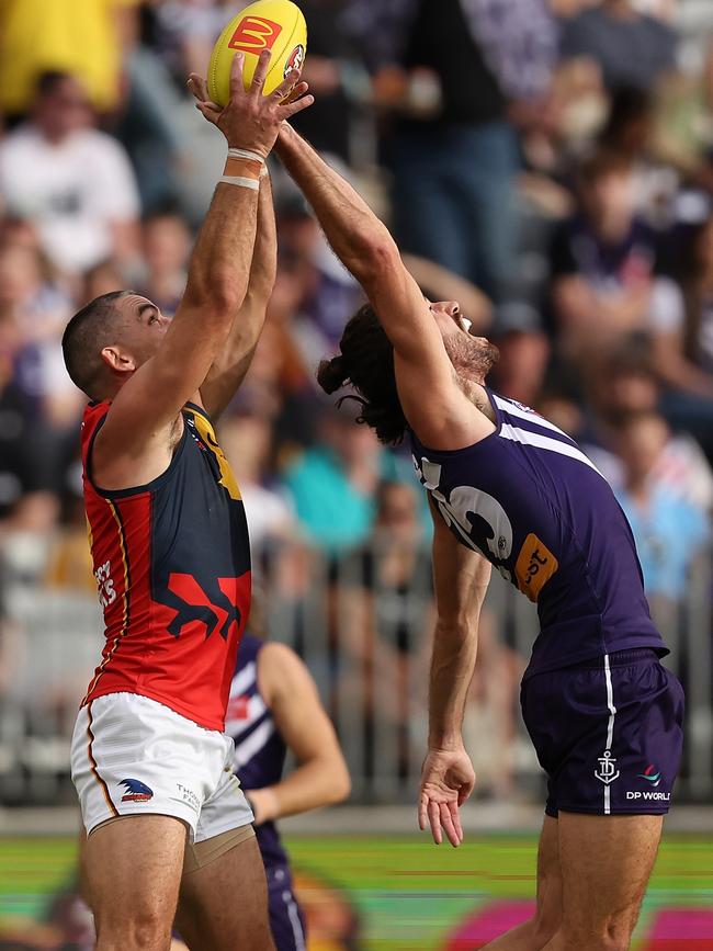 Taylor Walker attempts to mark against Fremantle’s Alex Pearce in Perth in Round 3. Picture: Paul Kane/Getty Images