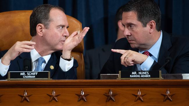 Adam Schiff, leader of the impeachment inquiry, exchanges words with ranking Republican Devin Nunes. Picture: AFP