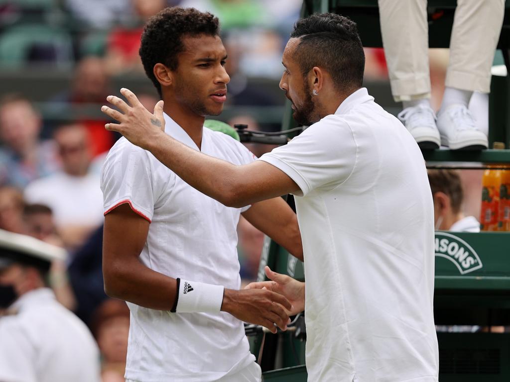Nick Kyrgios explains his decision to retire hurt to his opponent Felix Auger Aliassime of Canada. (Photo by Clive Brunskill/Getty Images)