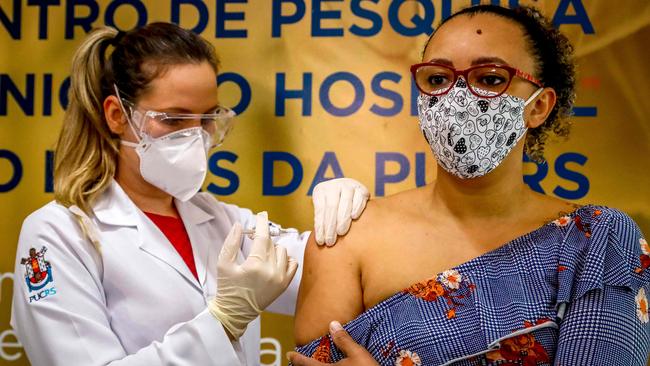 A health worker at Sao Lucas Hospital Hospital at Porto Alegre in southern Brazil administers a Sinovac Biotech vaccine to volunteer Fabiana Souza. Picture: AFP