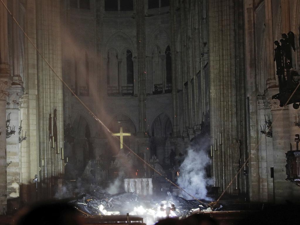 Inside the smouldering entrance of the Notre Dame Cathedral. Picture: Philippe Wojazer/Pool via AP.