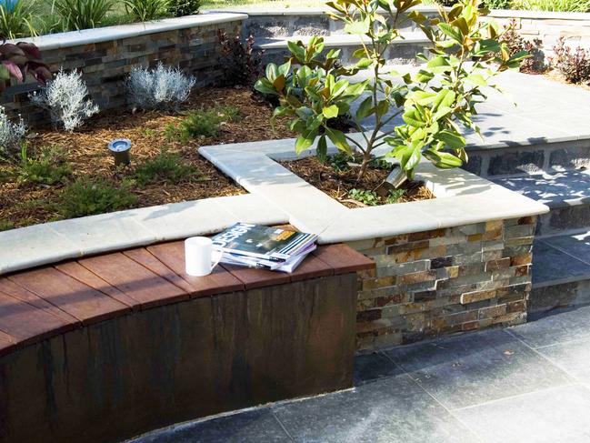 Solution: Retaining walls can help with a sloping garden. Picture: Fawcett Media