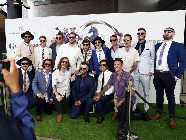 Punters have their photo taken with the Golden Eagle trophy. Picture: Sam Ruttyn