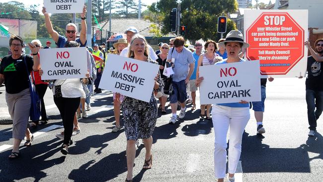 Opponents of an idea of building a carpark under Manly Oval marching around Manly protesting against it. Picture: Elenor Tedenborg.