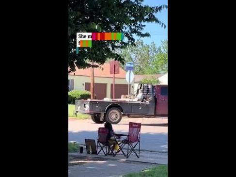 Little girl sells her own artwork outside home