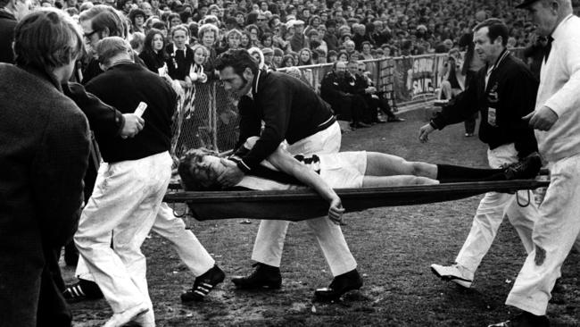John Greening is carried off on a stretcher after a clash in Moorabbin in 1972.